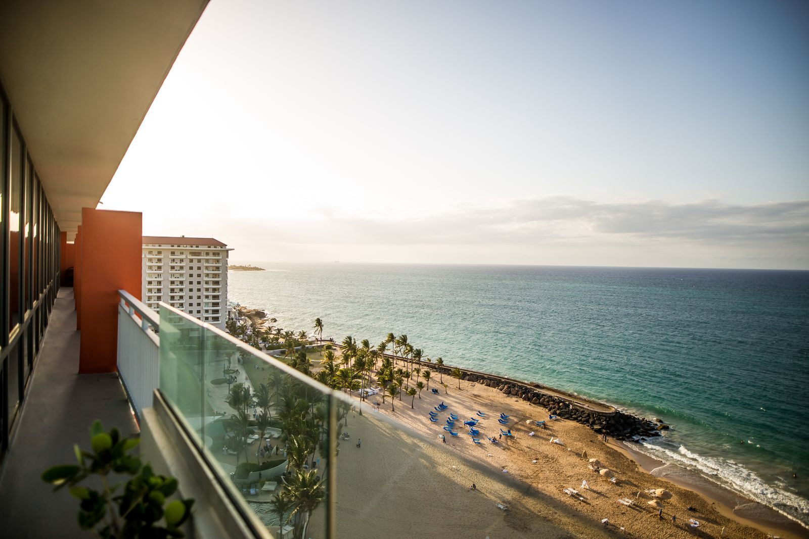 View of a tropical beach from a resort terrace