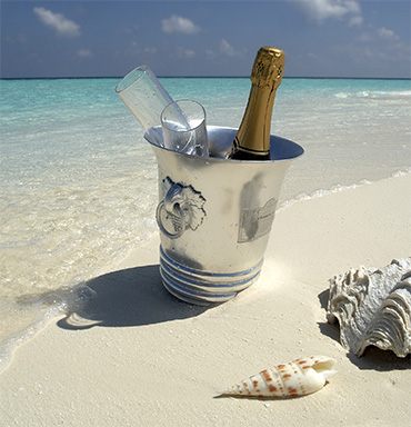 Champagne on ice on a white-sand beach
